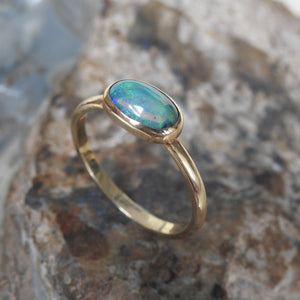 Solid Lightning Ridge Black Crystal Opal Ring with Green Blue Colors